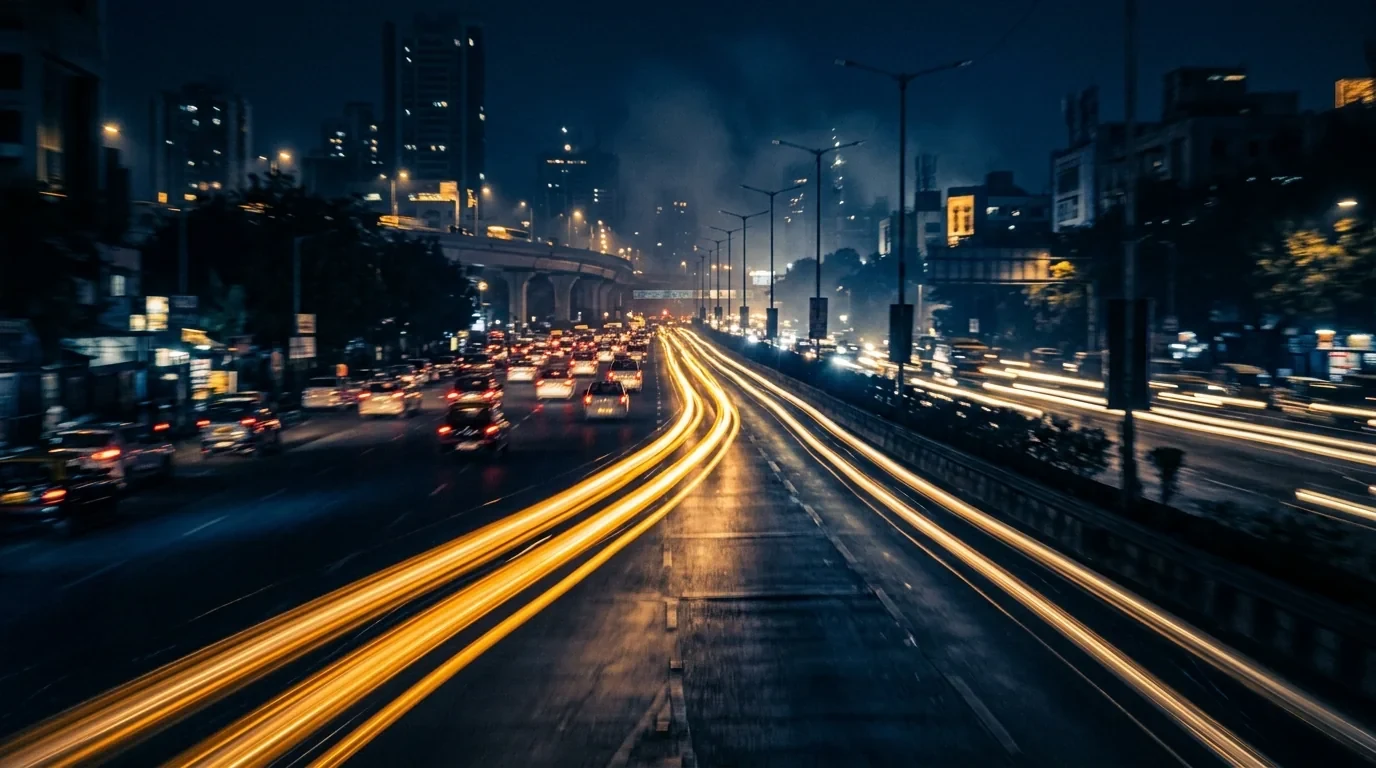 Light trails racing ahead through the dark, one pulling in front